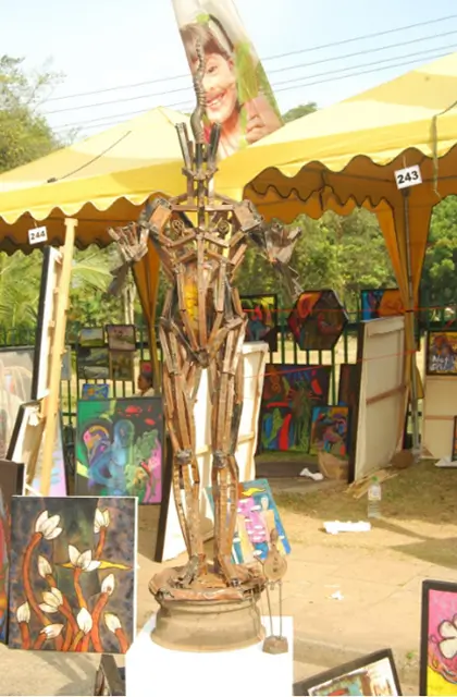 A detailed statue of a man, showcasing intricate craftsmanship and a dignified pose, set against a neutral background.