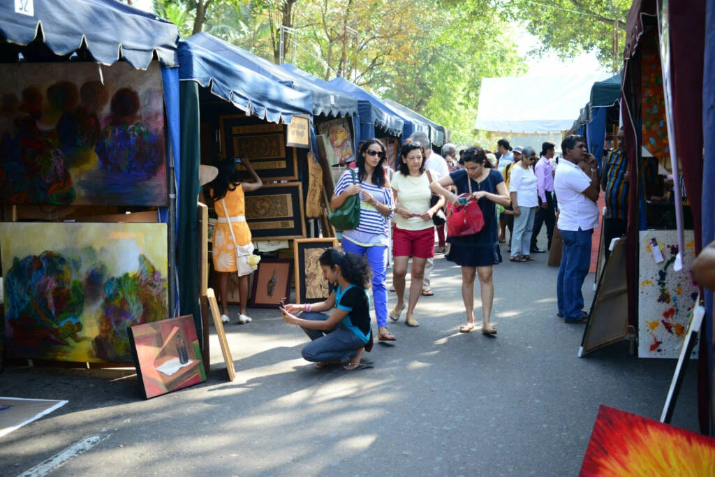A diverse group of individuals strolling along a bustling city street, showcasing urban life and community interaction.