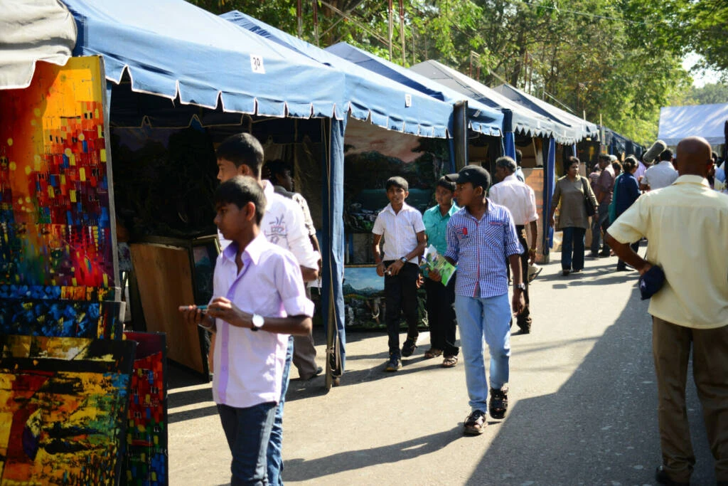 A collective of people walking side by side on a lively street, showcasing a variety of styles and interactions.