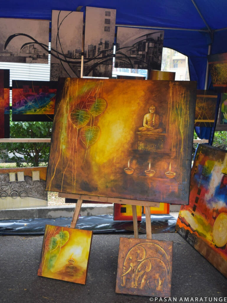 A paintings displayed on an easel, showcasing vibrant colors and intricate details in creative setting.