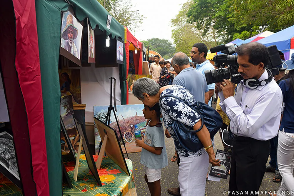 A man captures a photograph of another woman and a child, showcasing a moment of connection and joy.