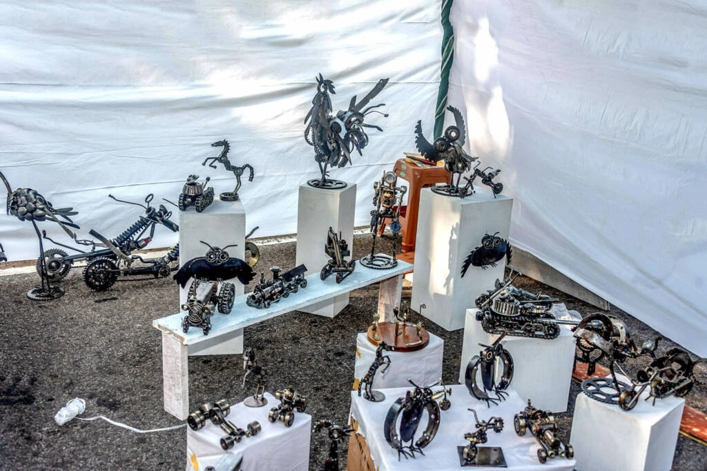 An artist diligently painting on a canvas, showcasing his creativity and skill.