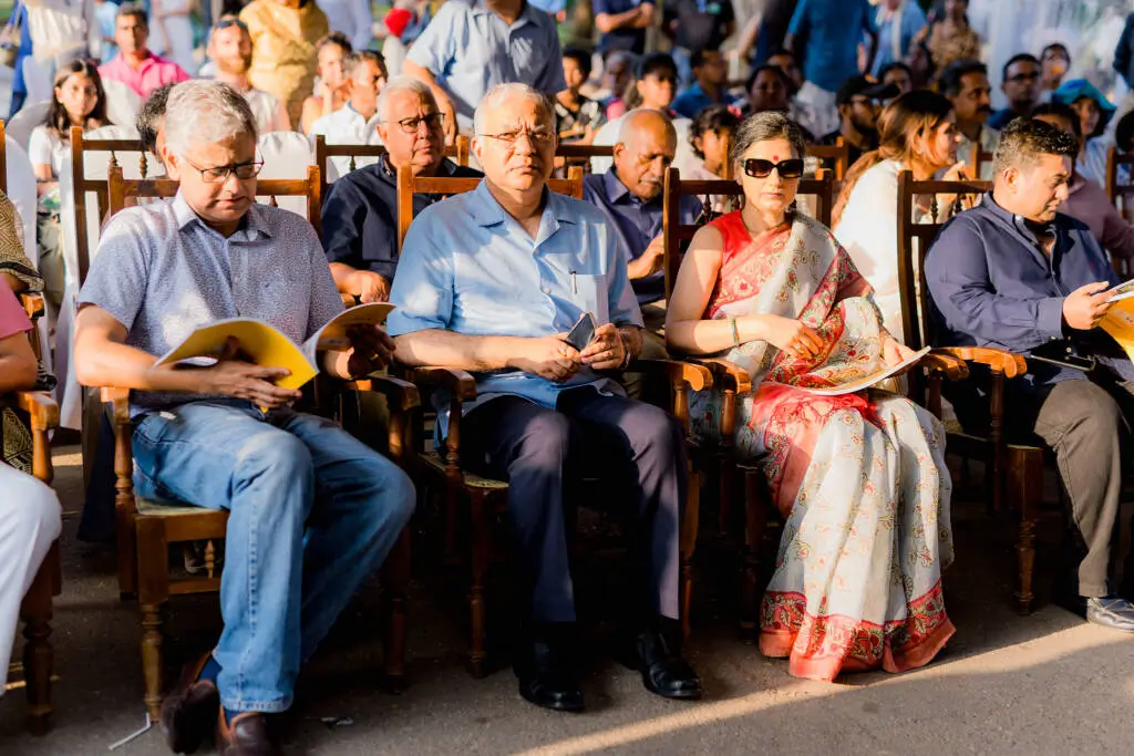 A group of people seated in chairs at an event