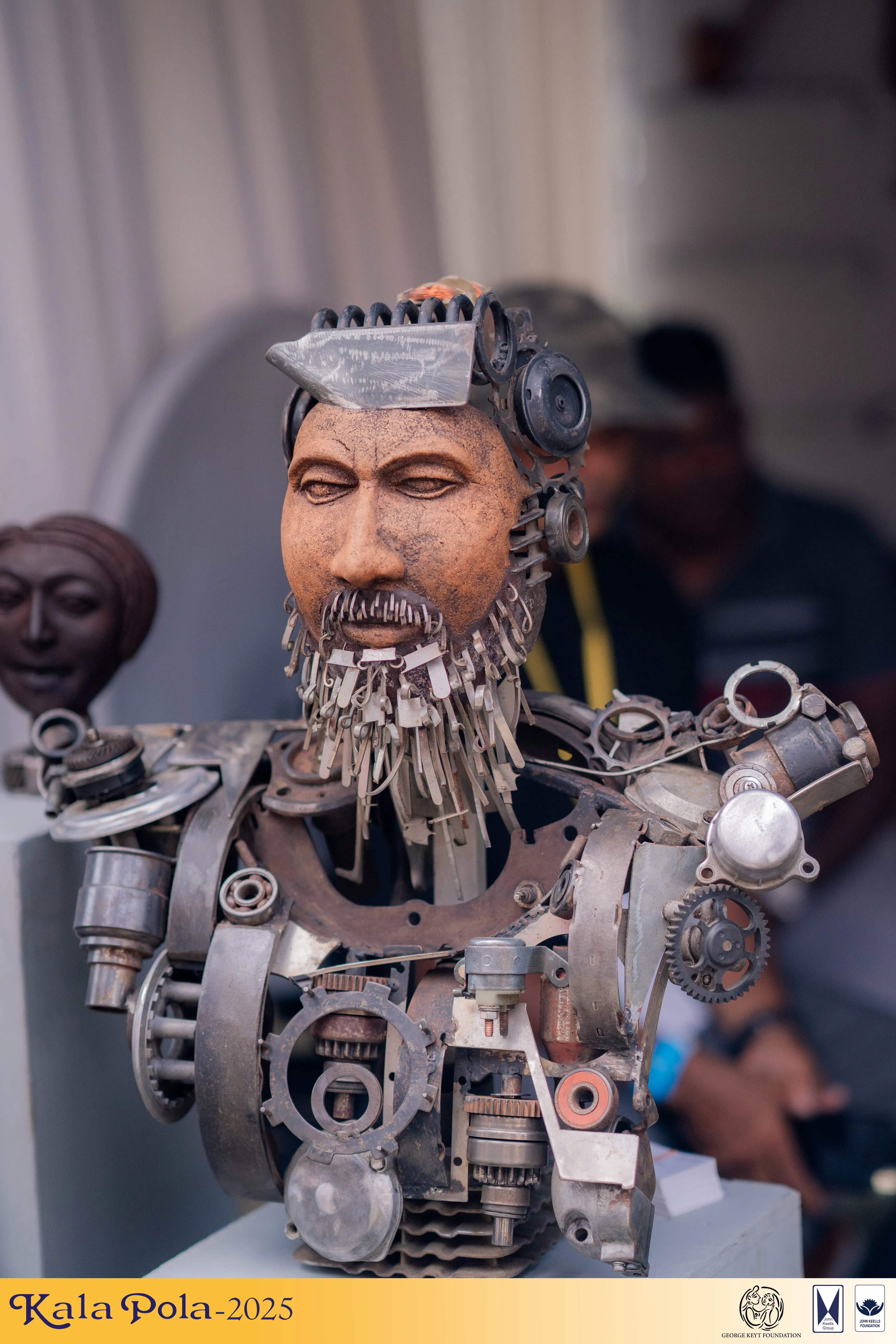 A person captures a photograph of a stage performance using a camera, focusing intently on the scene before them.