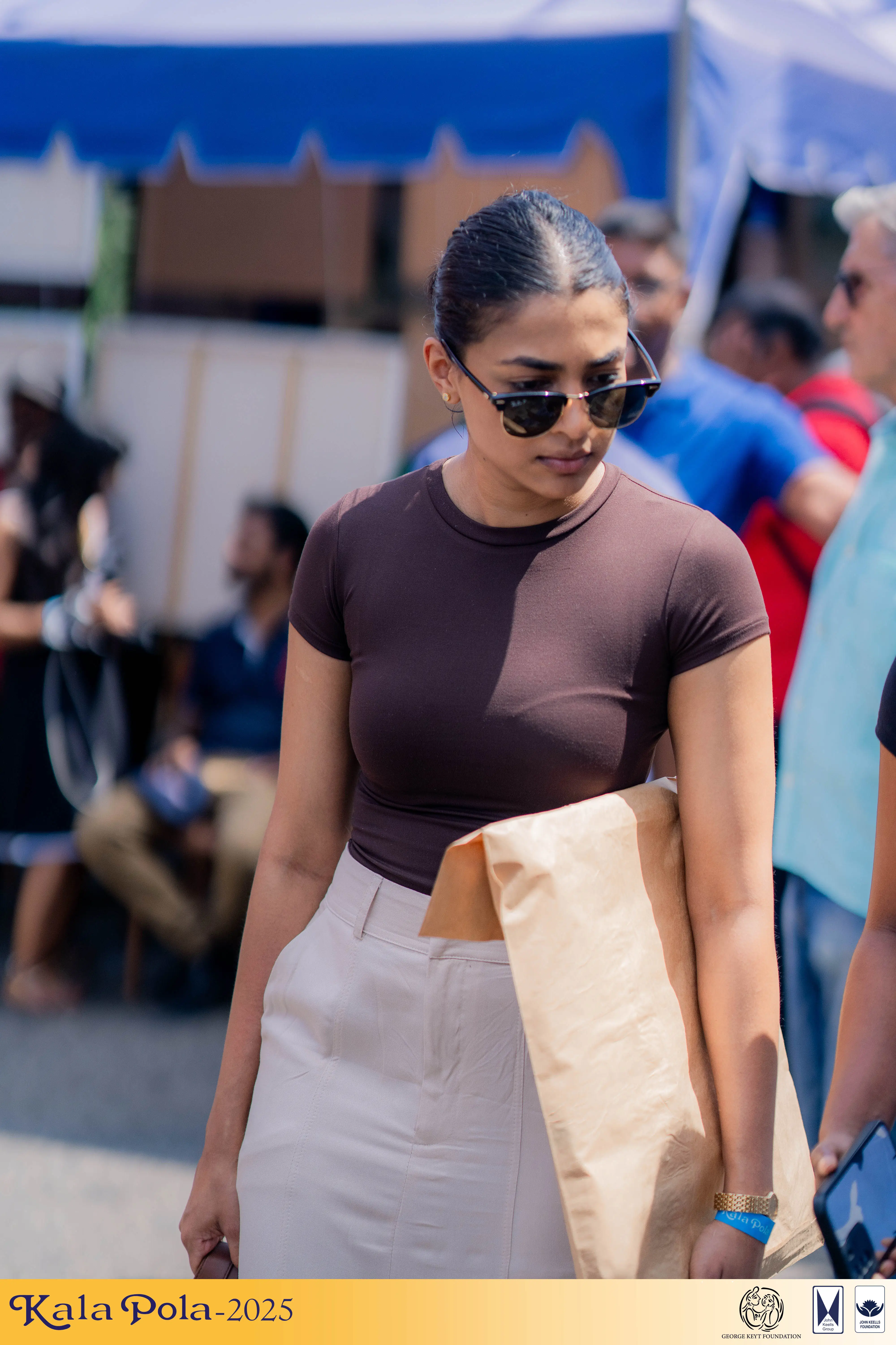 A diverse group of individuals performing energetically on stage, showcasing their talents to an engaged audience.