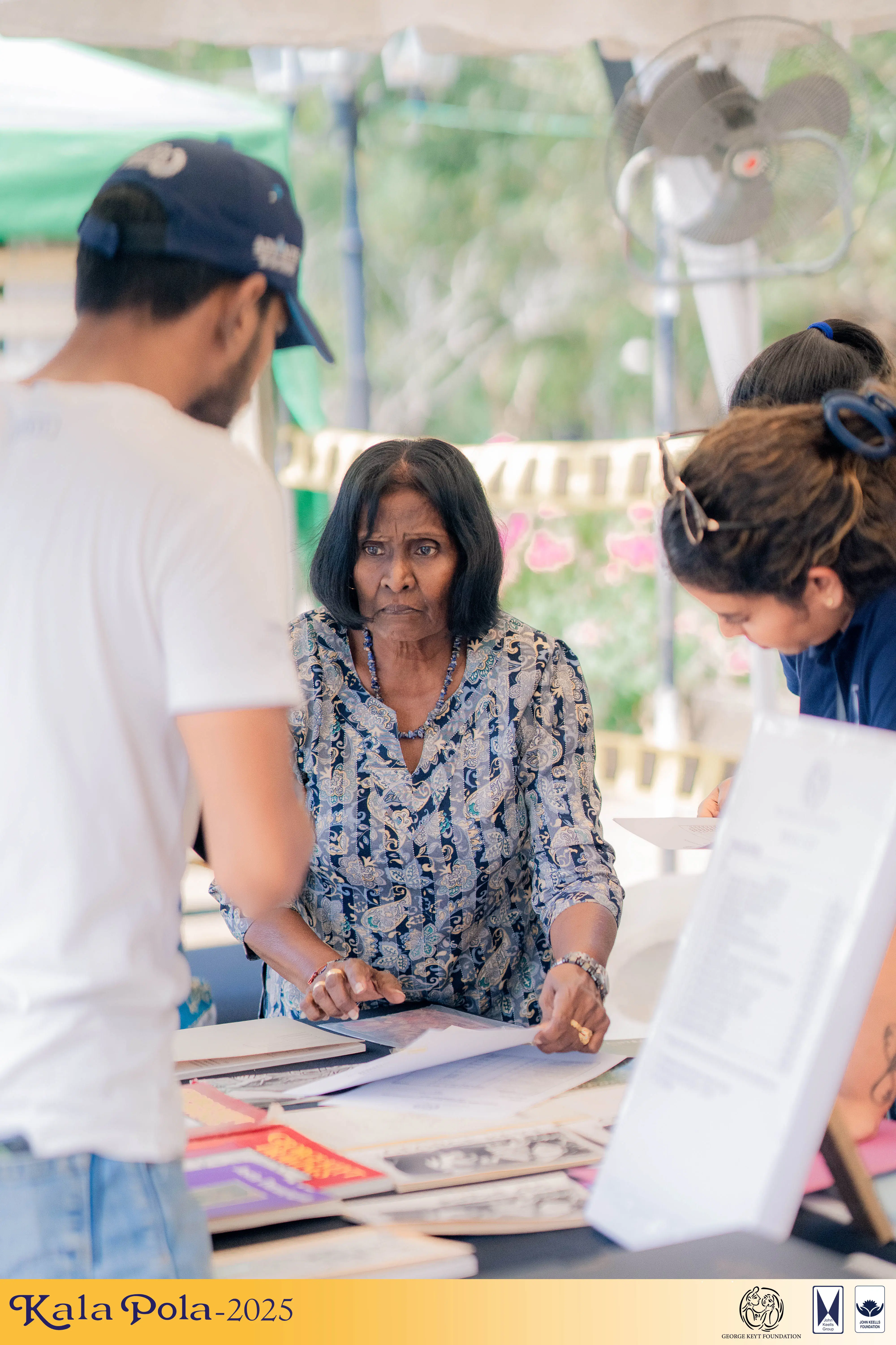 A diverse group of women joyfully performing a synchronized dance in a vibrant setting.